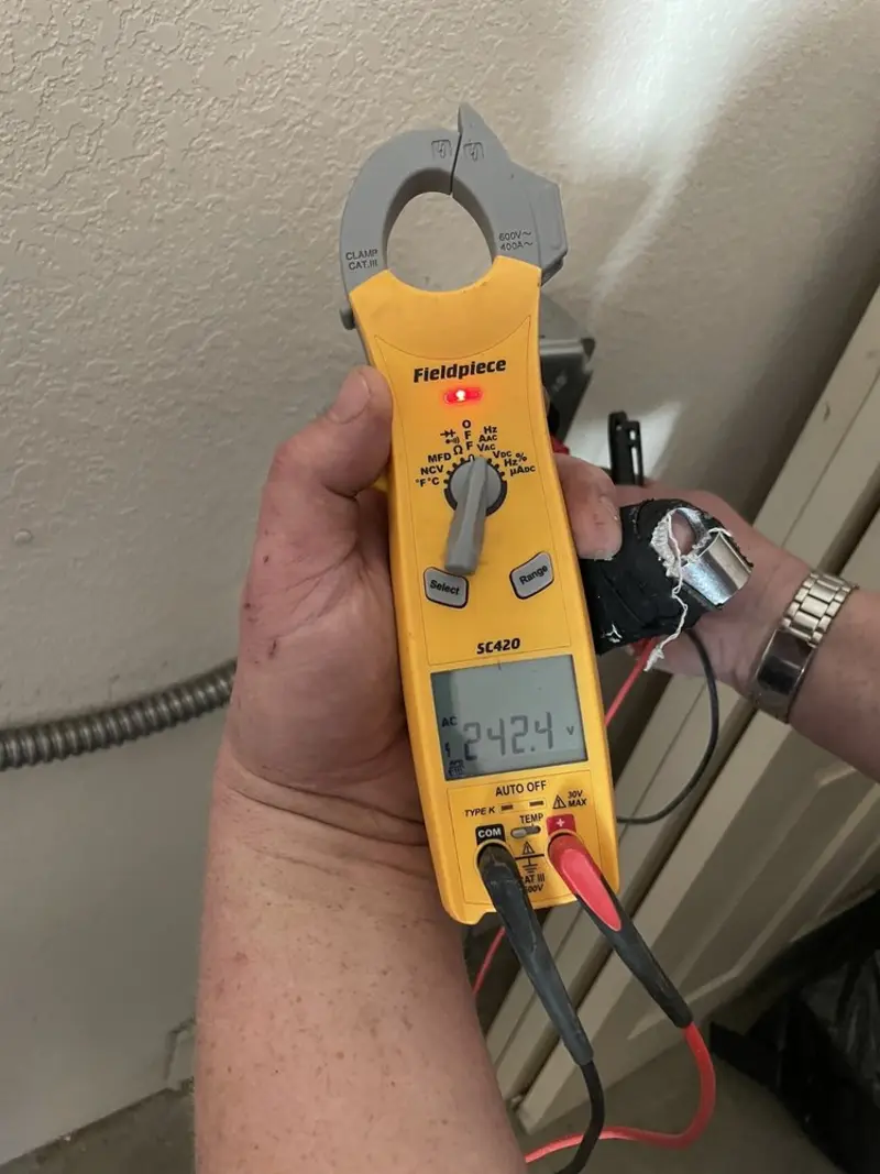 Voltage testing with clamp meter during Recessed Lighting Installation in Twin Falls